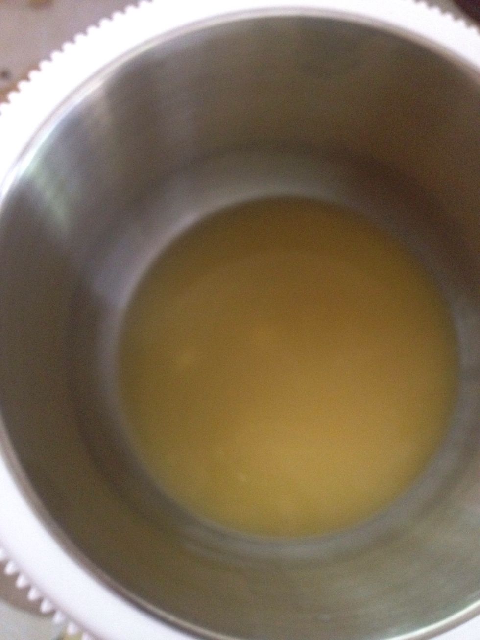 Pour the melted butter into the pan