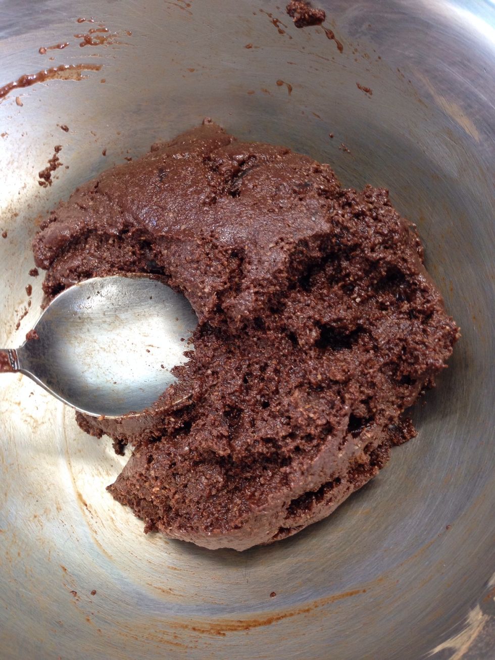 Pour the melted coconut butter and rice syrup mix over the dry ingredients. Add the chopped dates and vanilla extract and stir together well.