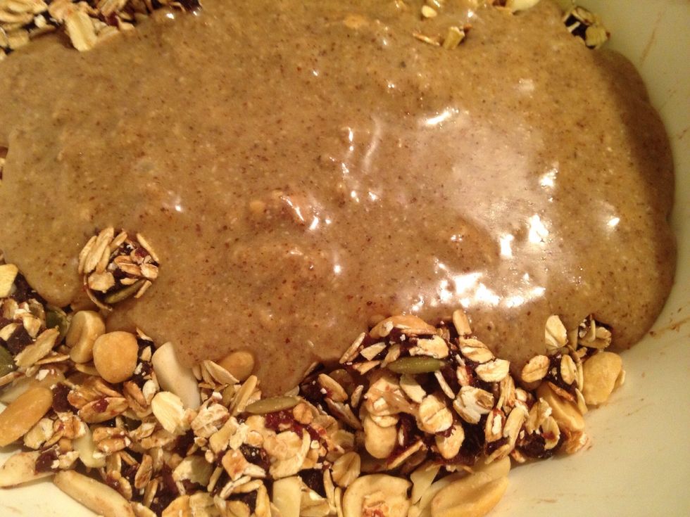 Pour the melted honey and almond butter over the dry ingredients and mix