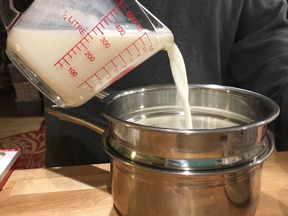 Pour the milk in a double boiler