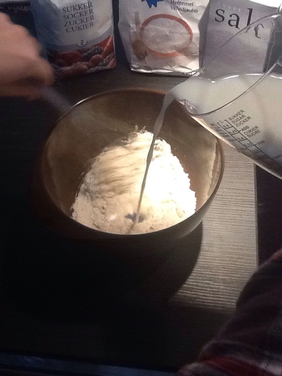 Pour the milk in the while stirring. Keep stirring until there's no more lumps.