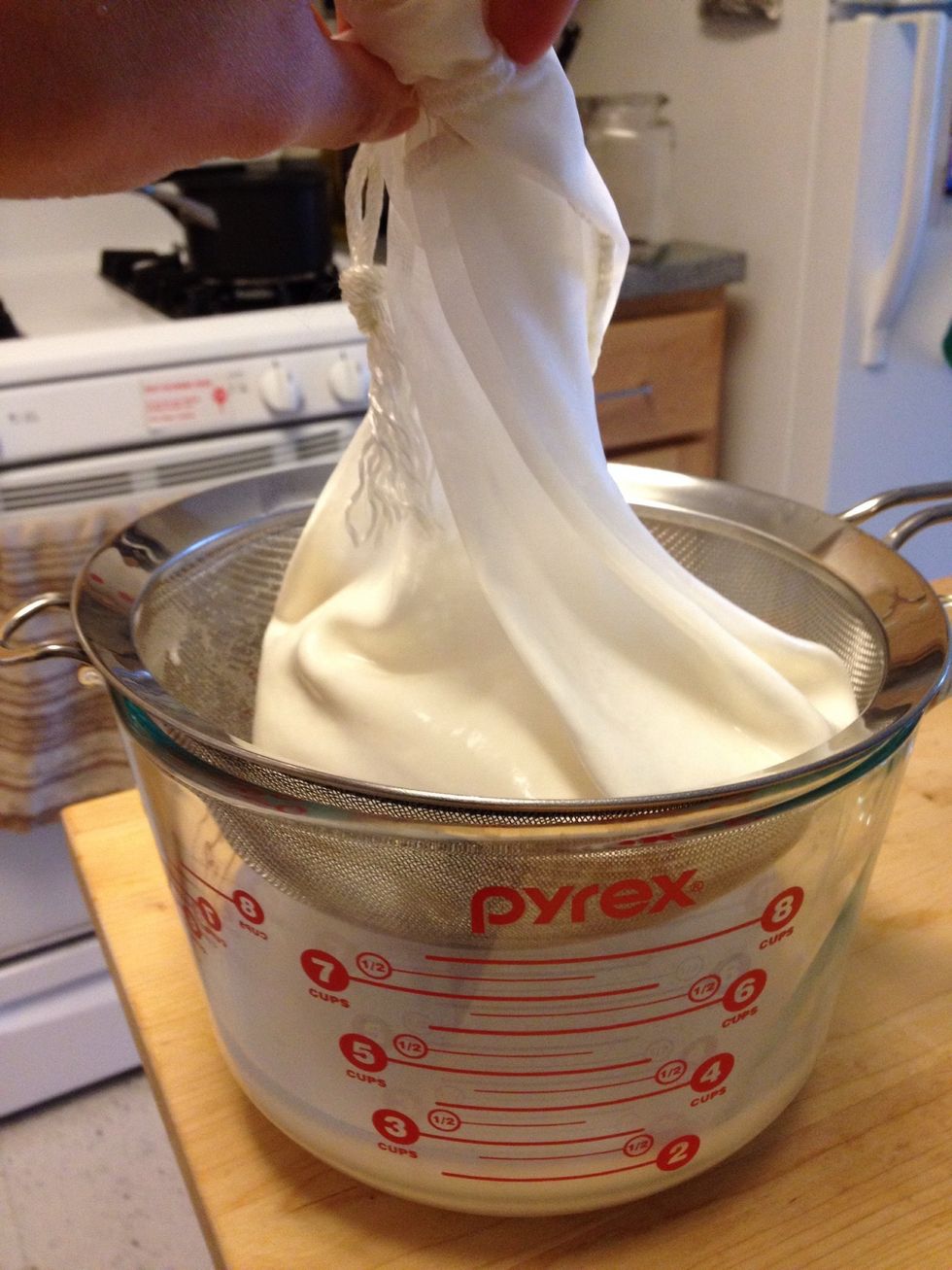Pour the milk into the milk bag. I don't like cheese cloth. A superfine mesh nylon bag is the best way to do this.