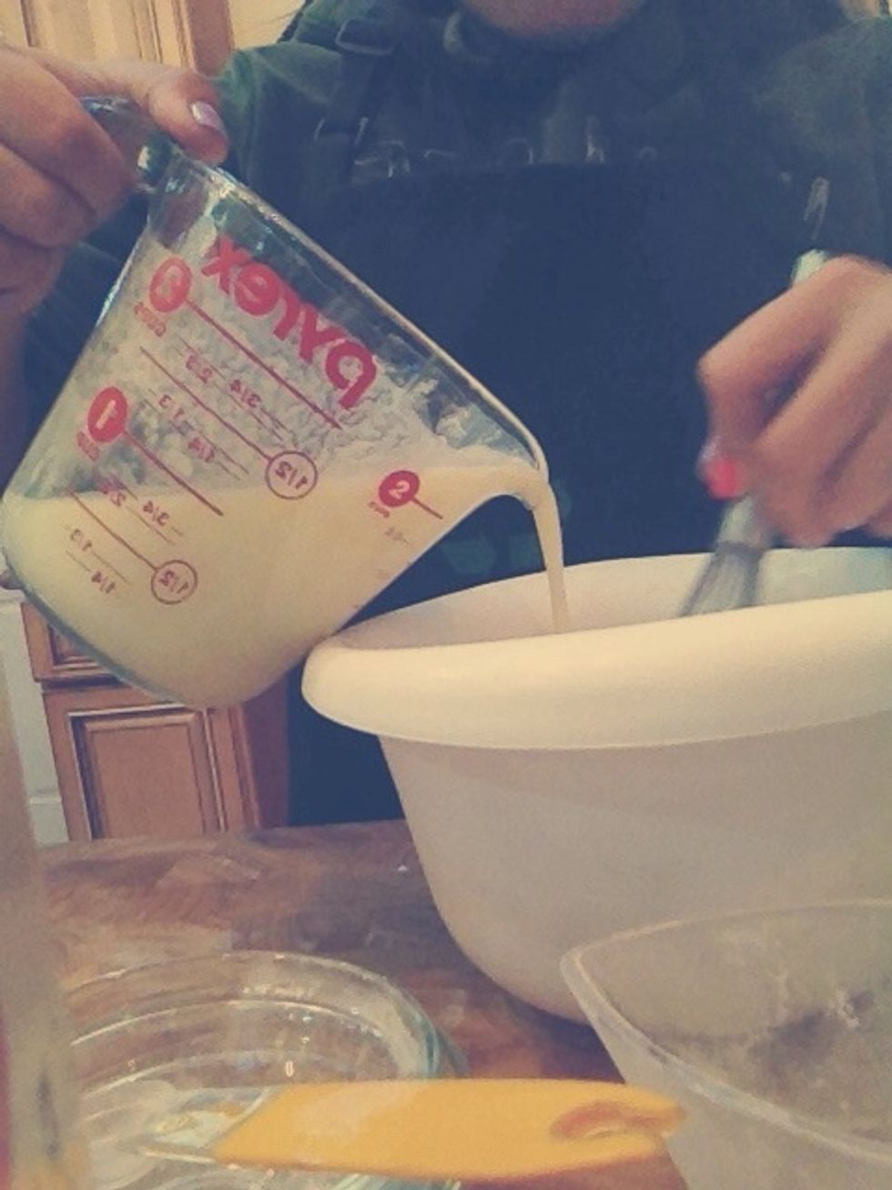 Pour the milk mixture into the flour mixture
