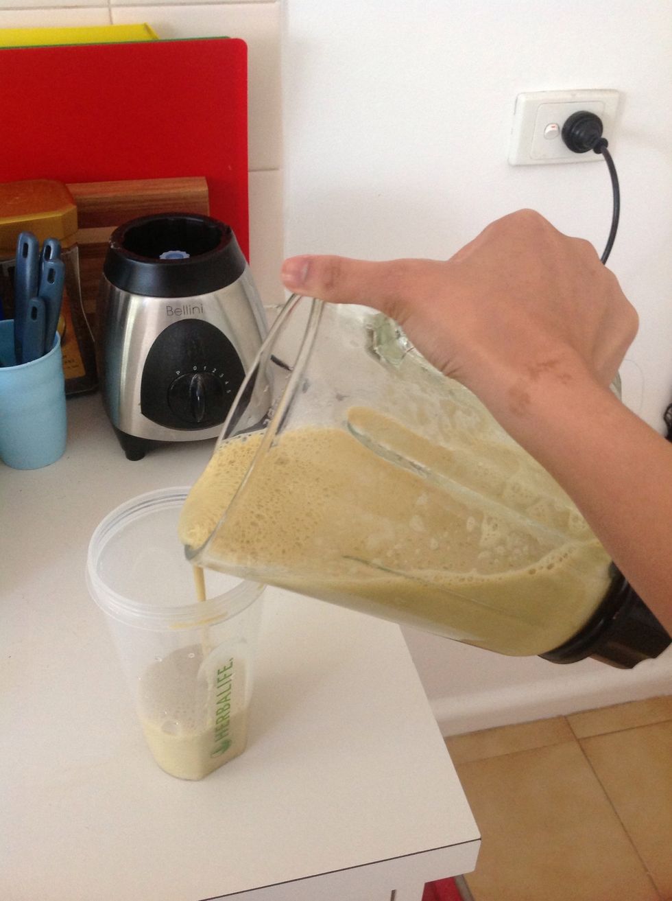 Pour the mix into the shake holder. If there is any left over, pour the remaining mix into a glass.