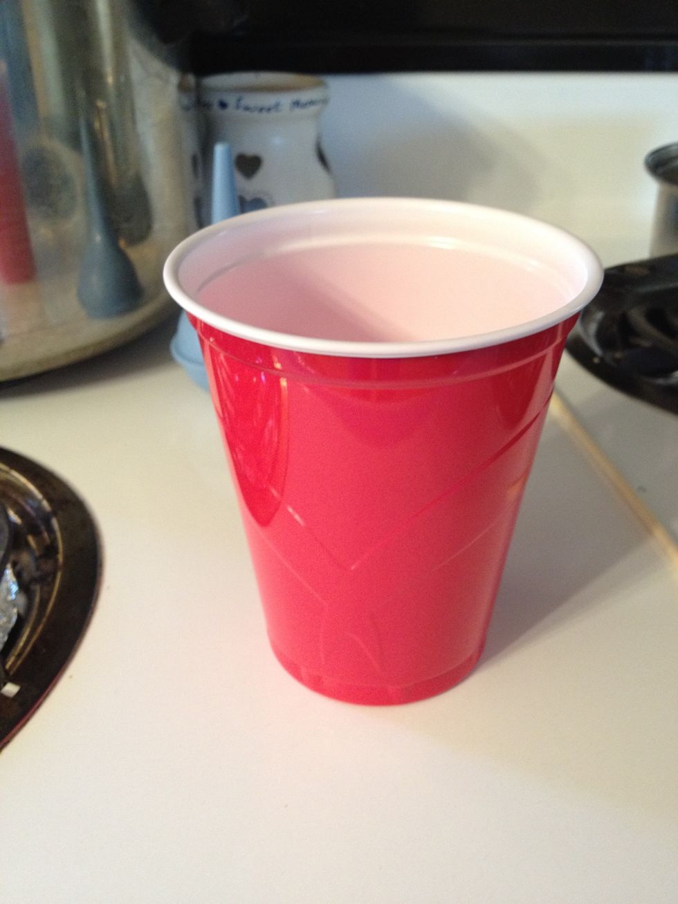 Pour the mixed Saline spray into a clean cup.