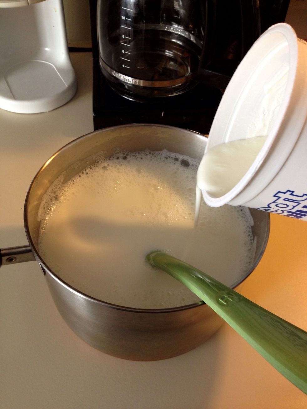 Pour the mixture back into the milk in the saucepan. Stir so that everything combines.