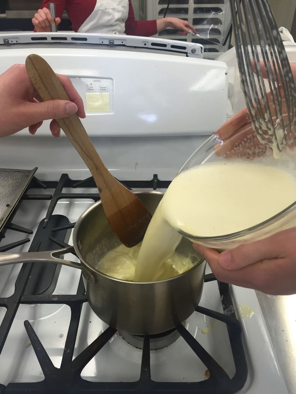 Pour the mixture back into the saucepan. Cook over medium heat, stirring constantly, about 5 minutes, until the mixture is thickened and coats the back of a spoon.