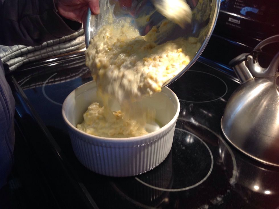 Pour the mixture in the bowl into the lightly greased baking dish