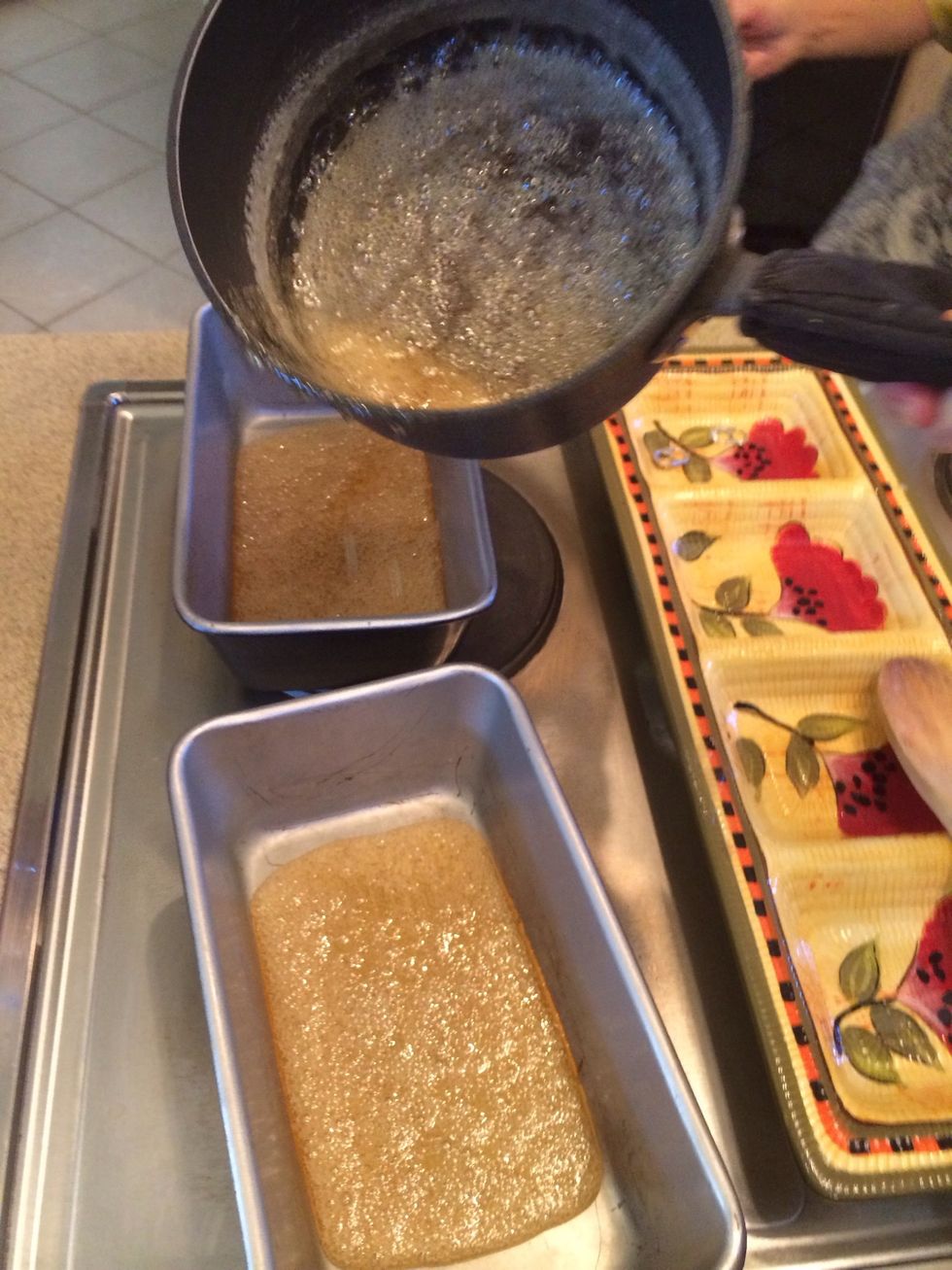 Pour the mixture in to line the bread pans.  You will pick up the pans and swirl them around to get the sugar up the sides.  Doesn't have to be all the way up.