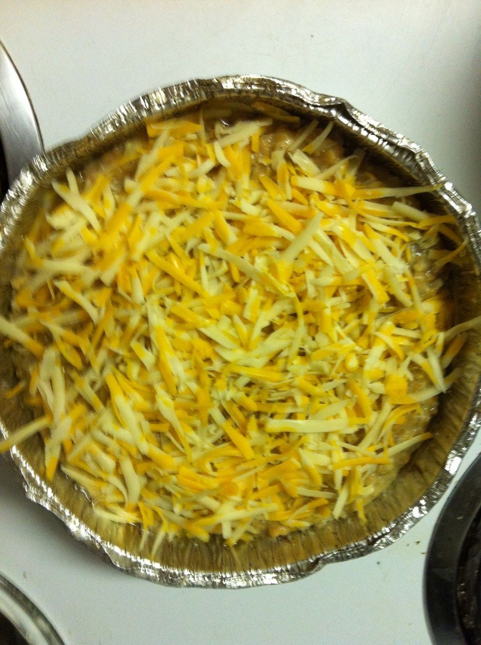 Pour the mixture in your cooking pan and add the remaining cheese on top and toss 'er in the oven.