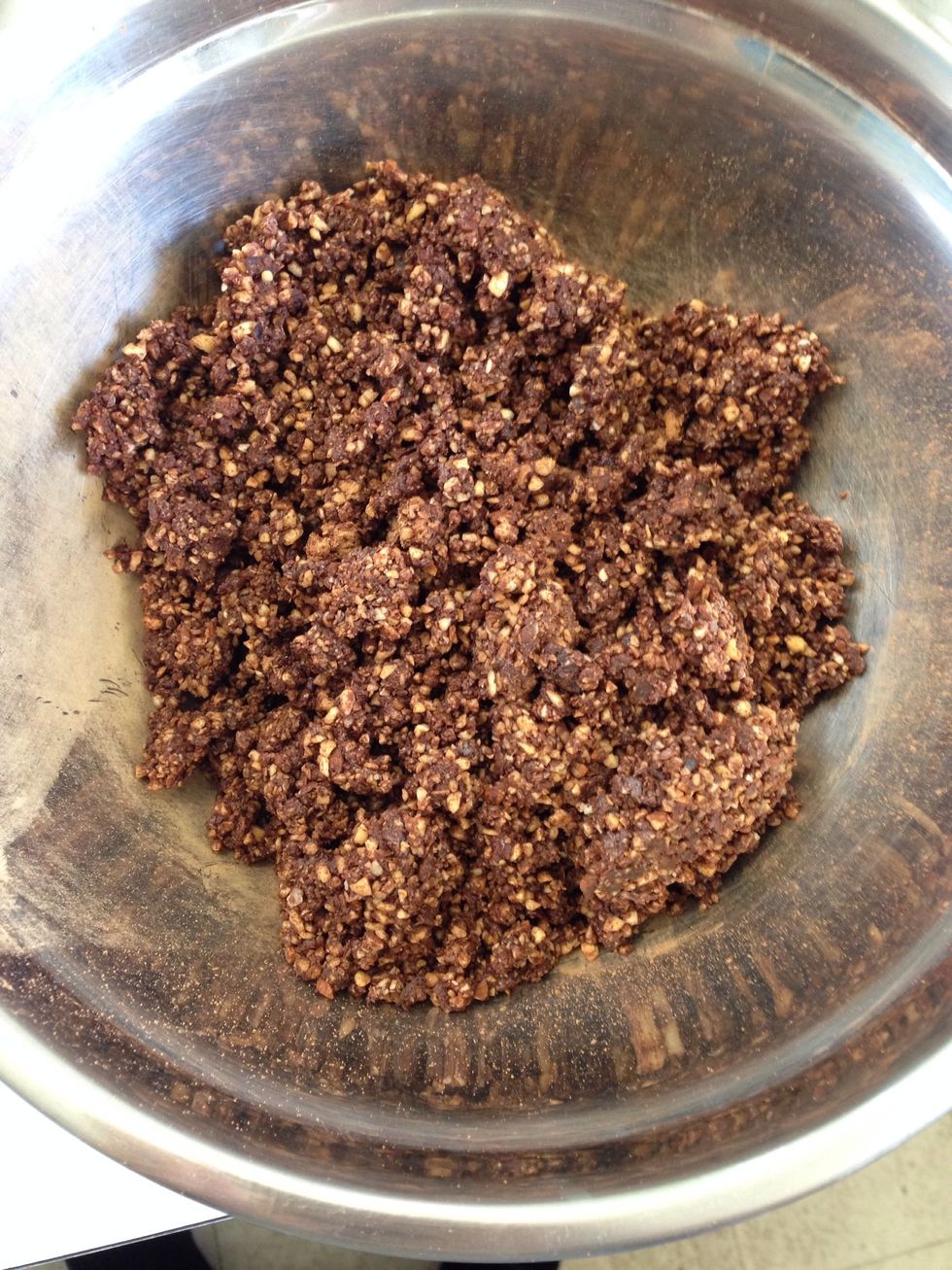 Pour the mixture into a large bowl and add 2 tablespoons of water so that it sticks together well.