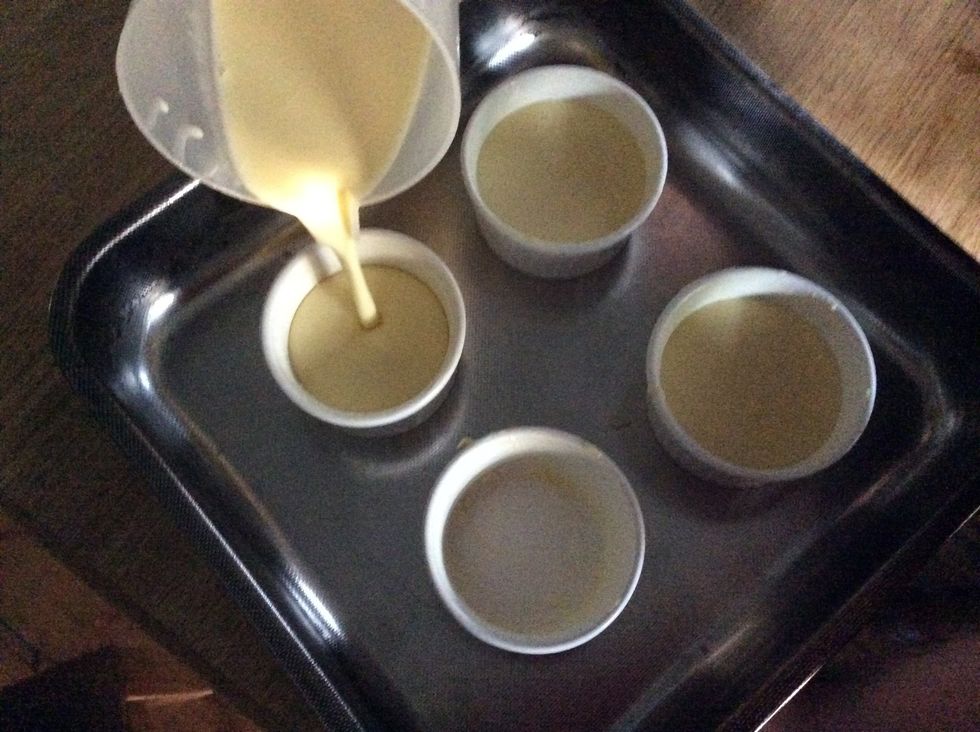 Pour the mixture into ramekins