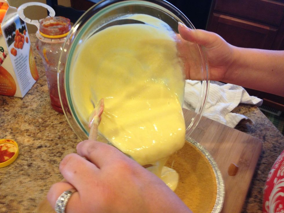 Pour the mixture into the graham cracker crust.
