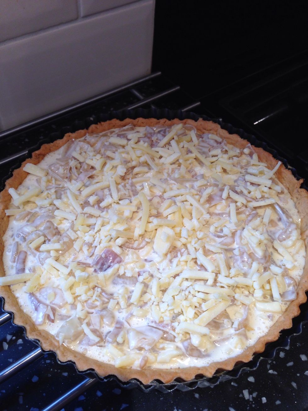 Pour the mixture into the pastry case and top with the remaining cheese