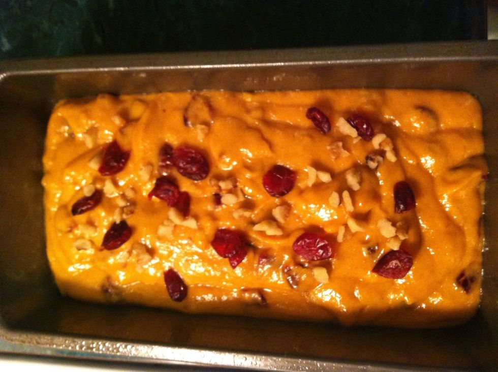 Pour the mixture into your loaf pan and garnish the top with extra nuts and cranberries if you desire \ud83d\ude0a Now bake the loaf for 45-50 mins (in 9" pan) and approx. 40-45 mins for the smaller pan