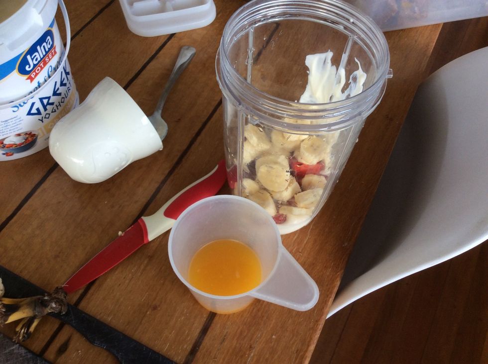 Pour the orange juice into the blender