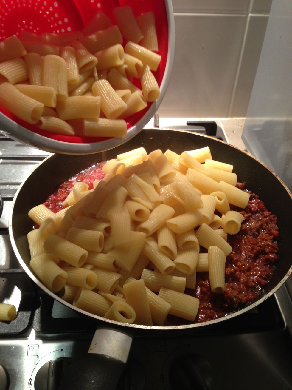 Pour the pasta into the fry pan on top of the mince