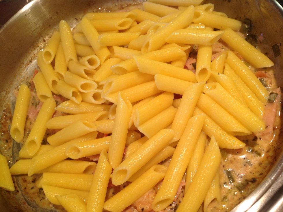 Pour the pasta into the pan.