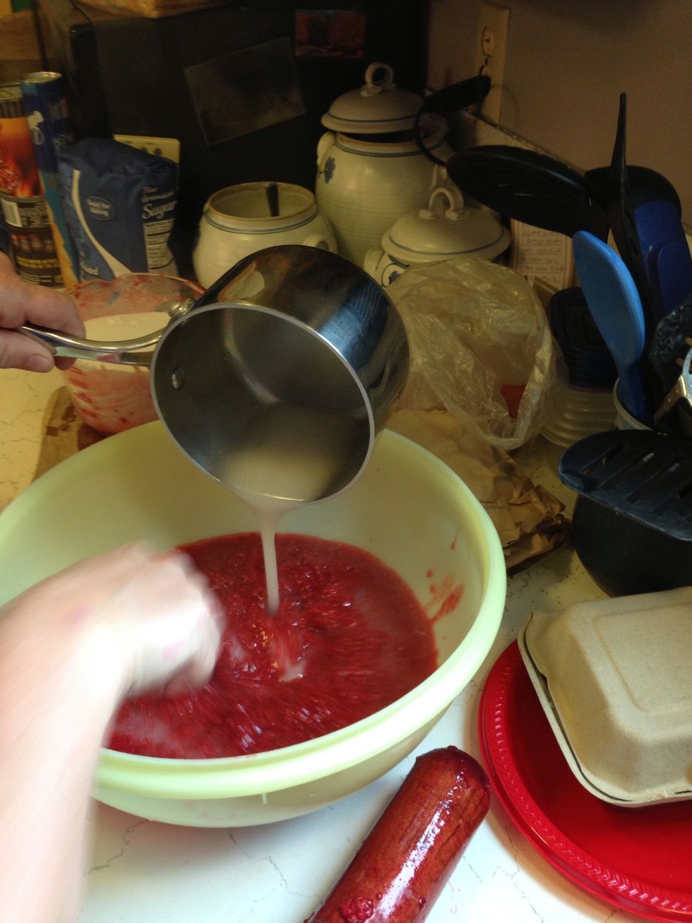 Pour the pectin mixture into the mashed berries.