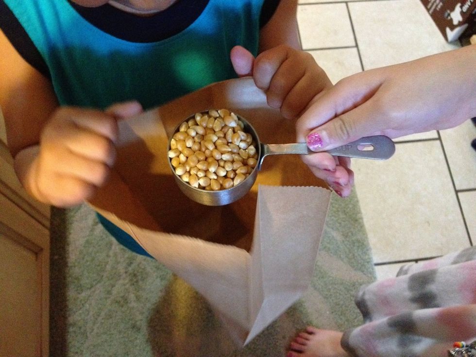 Pour the popcorn in