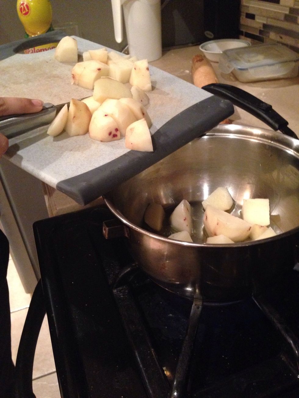 pour the potatoes into a pot