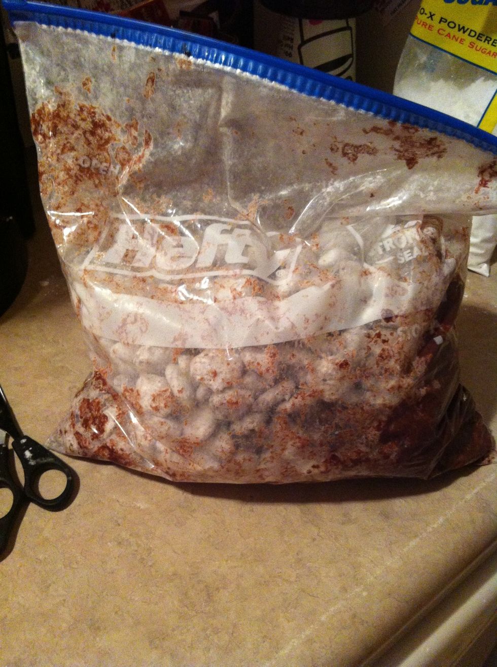 Pour the puppy chow into a large bag and add your powdered sugar and shake until evenly coated with sugar.