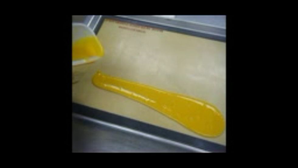 Pour the pur\u00e9e over a silpat on a sheet pan.