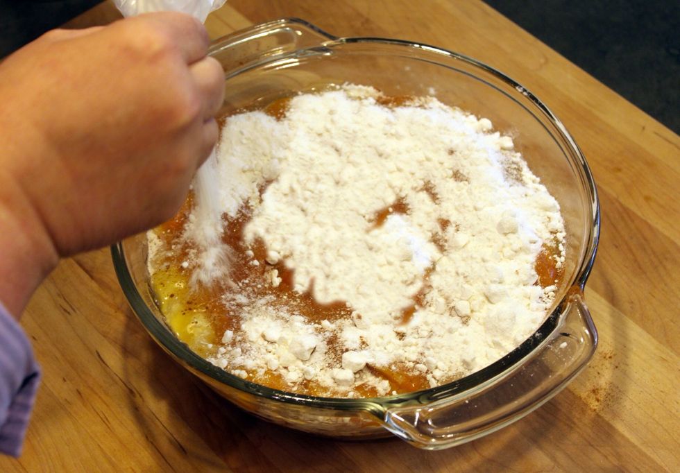 Pour the remaining cake mix on top and shake it to even it out.