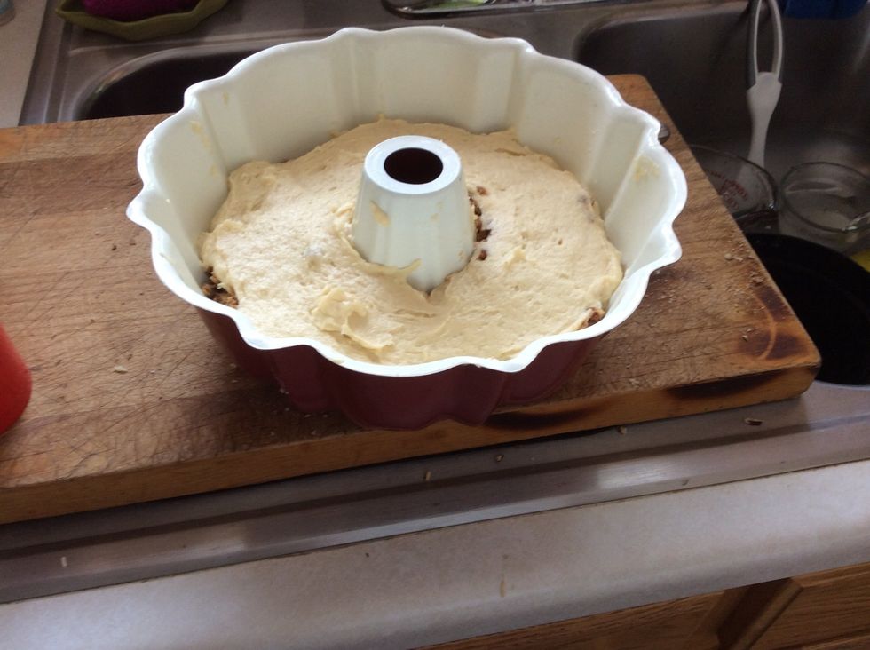 Pour the rest of the cake mix on top of the pecan mix.
