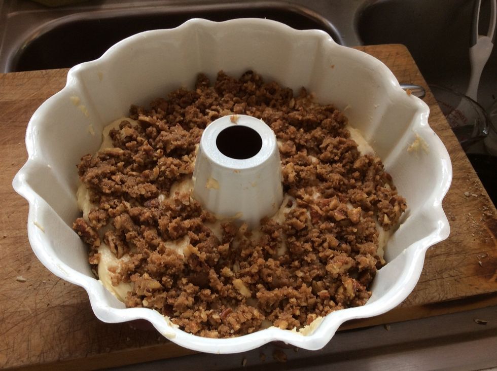 Pour the rest of the pecan mix on top of the cake mix.