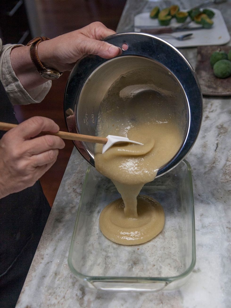 Pour the strained guava puree into a Pyrex dish.