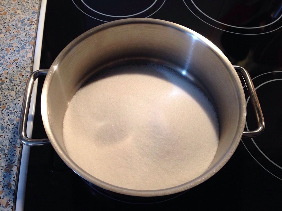 Pour the sugar in a wide pot.