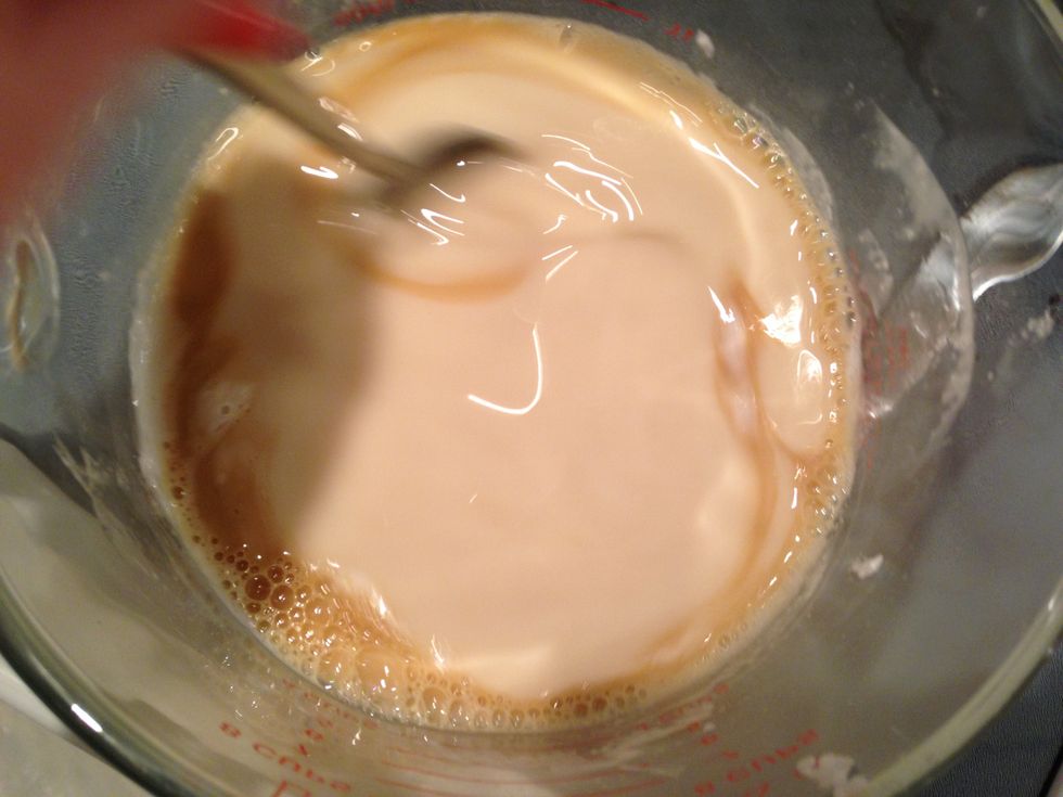 Pour the tea into the melted soap and stir.