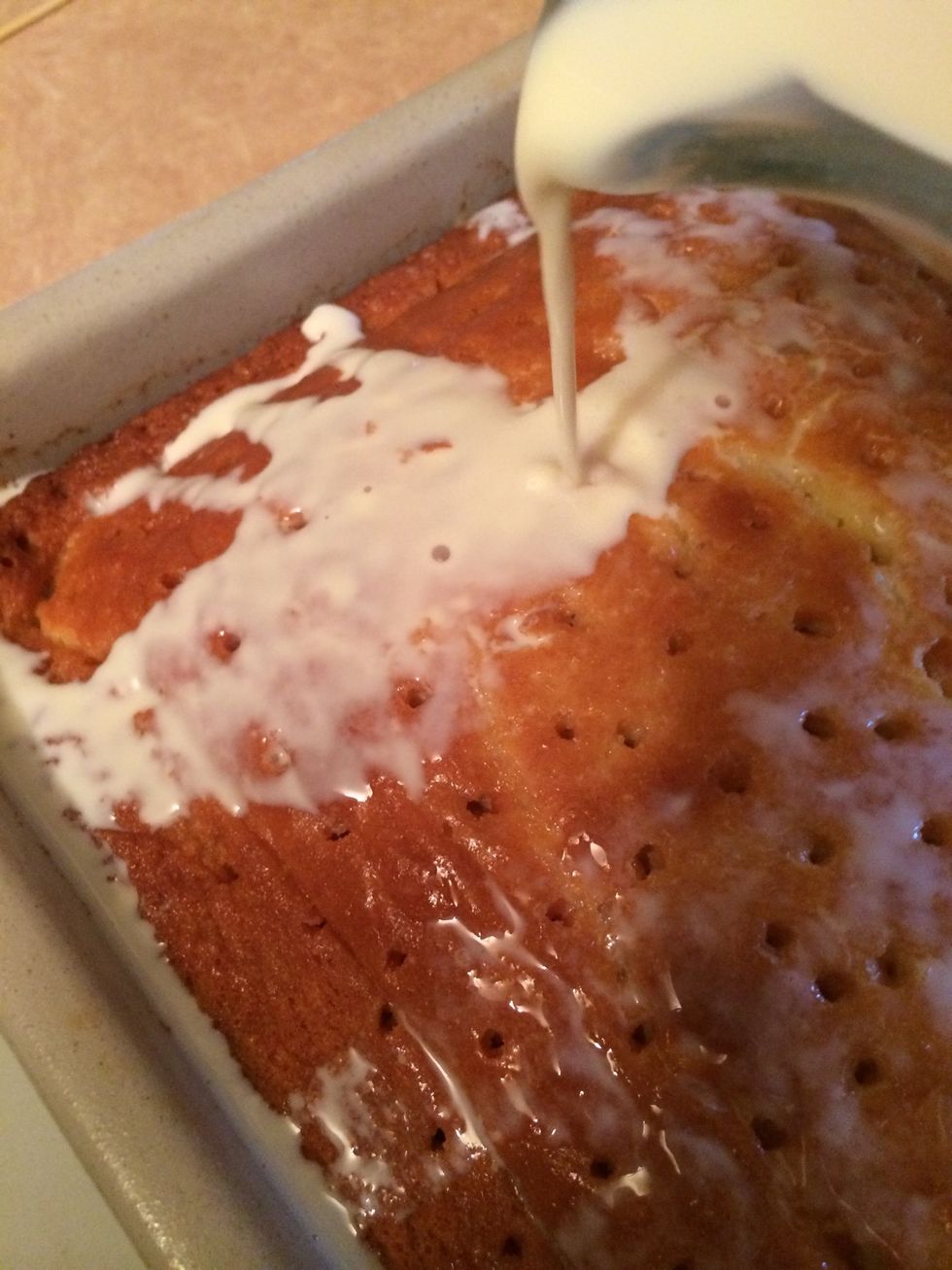 Pour the three milks mixture over the cake, reserving a cup of the liquid to use later as a garnish while plating the cake. Cover and refrigerate over night.