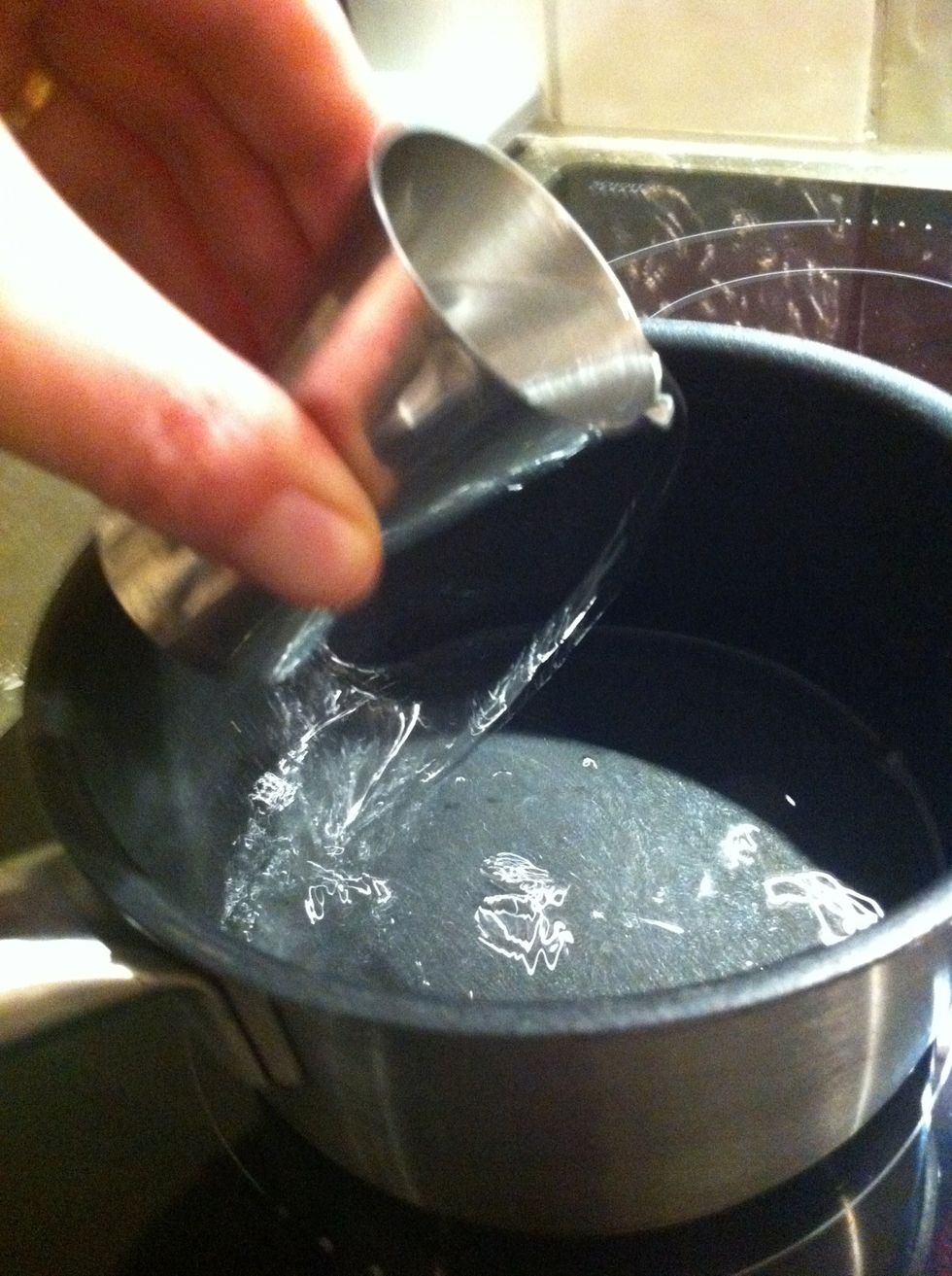 Pour the tsipouro in a pot and heat slowly