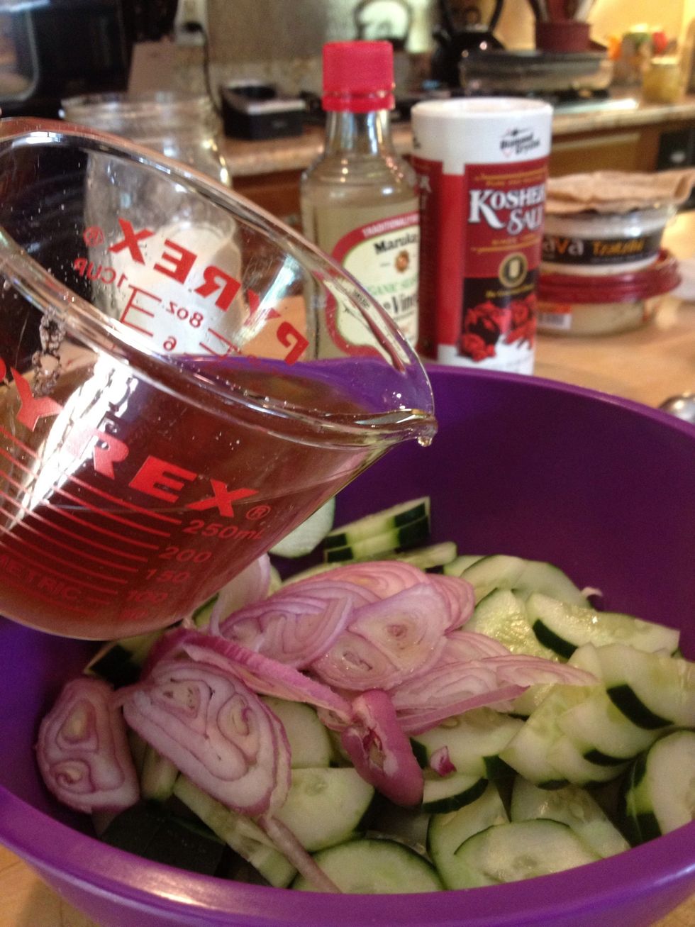 Pour the vinegar mixture over the cucumber and shallot mixture. Mix well, separating the slices.