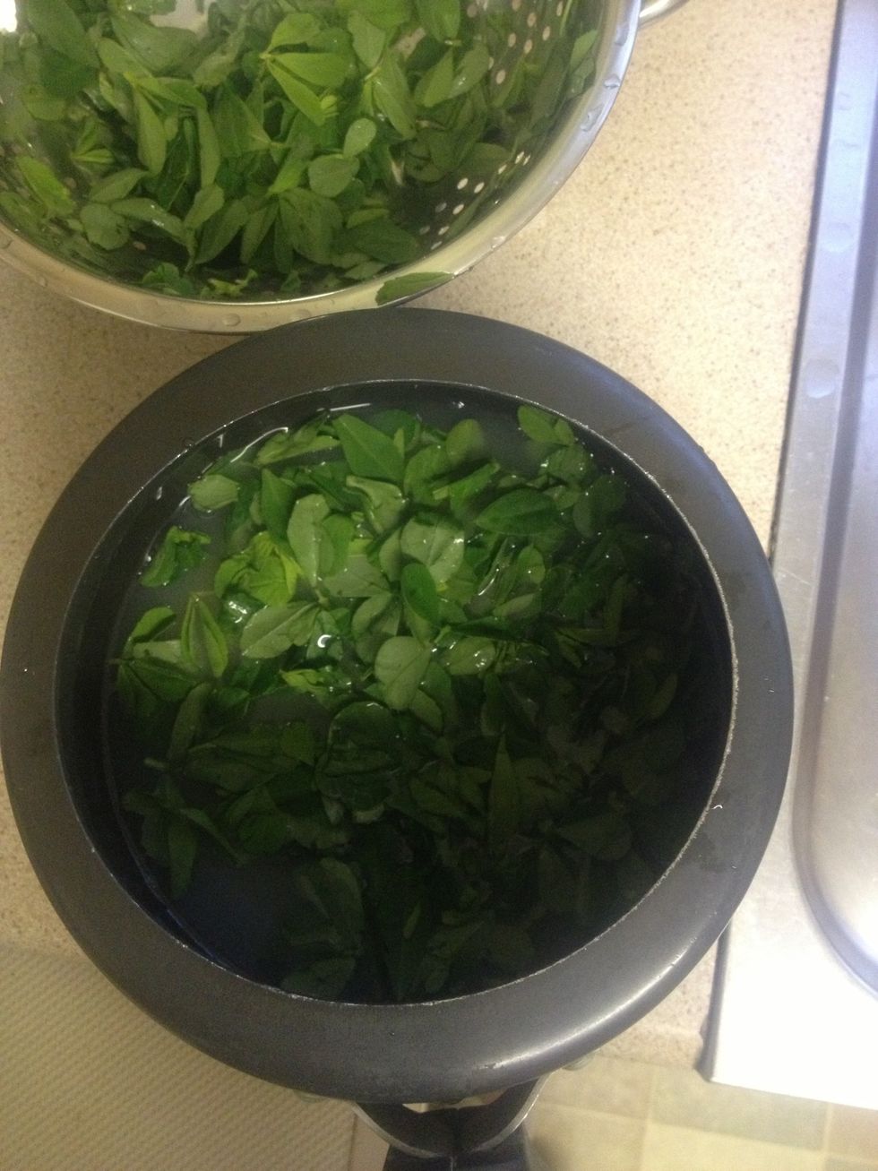 Pour the washed leaves into the dal