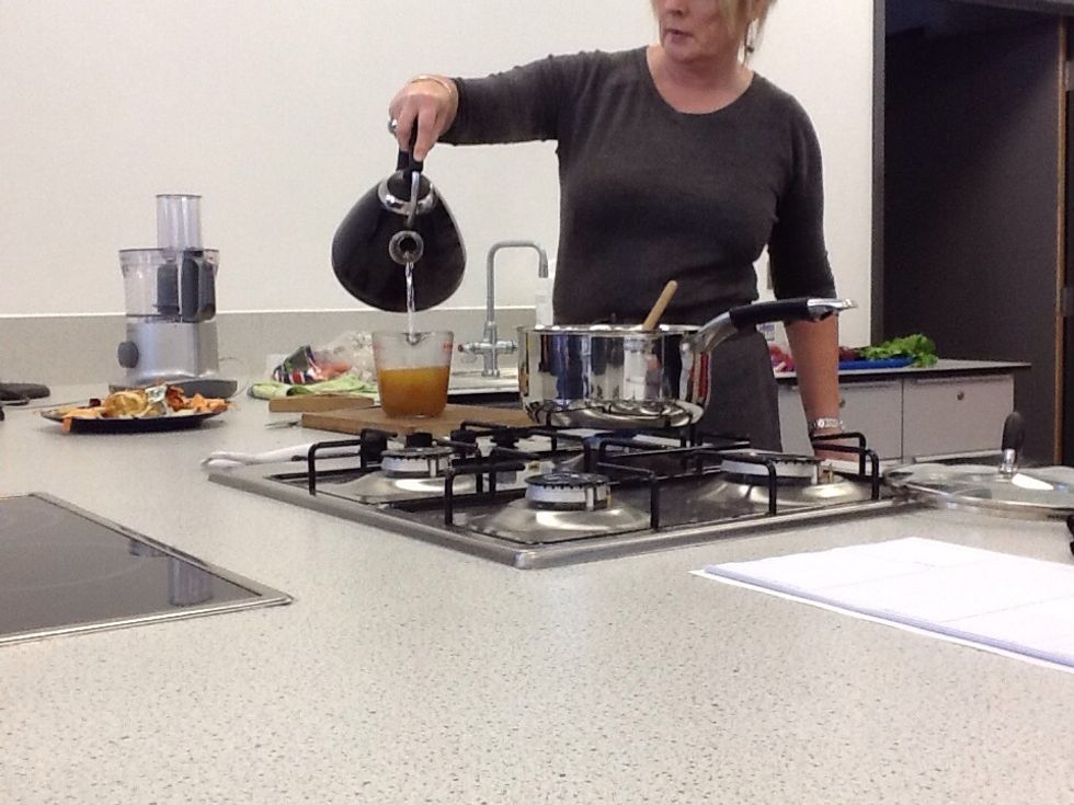 Pour the water into the measuring bowl which still has the stock cubes in. Pour it to 500ml