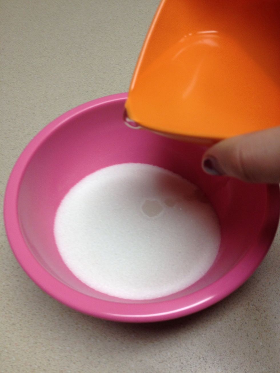 Pour the water into the sugar and mix quickly.  This should be the texture of wet sand