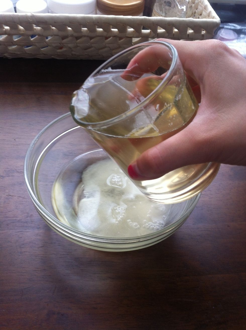 Pour the water into your oil wax mixture. The mixture will instantly turn cloudy. Mix well.