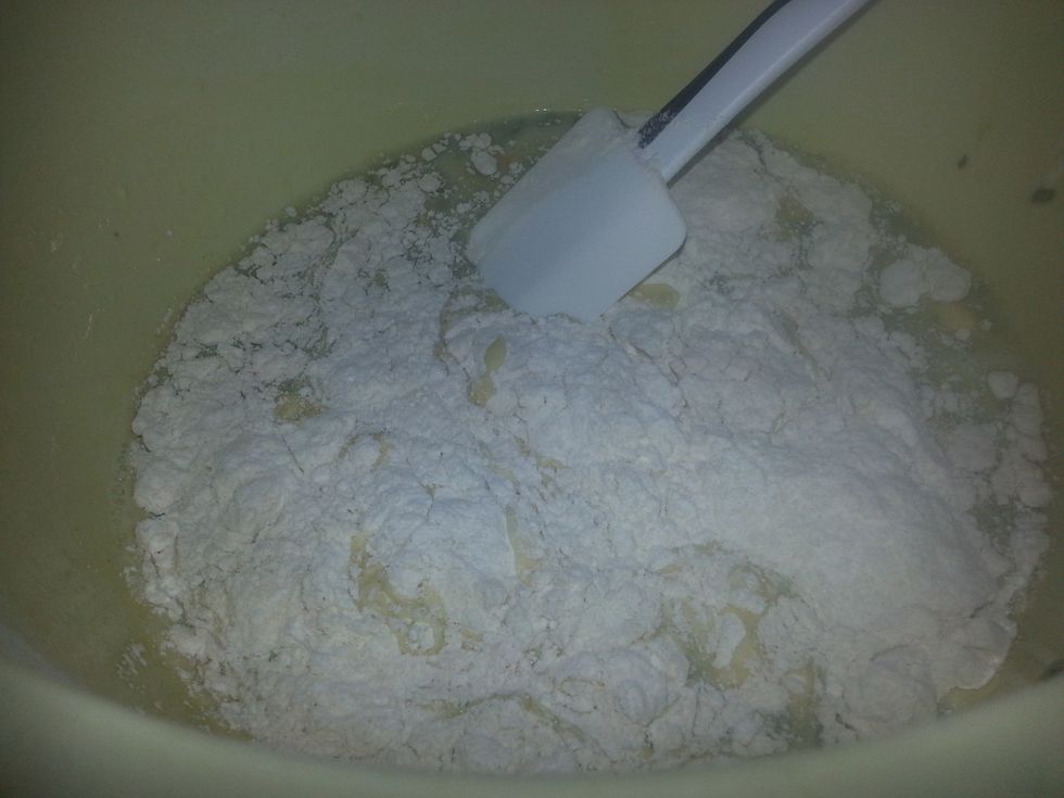 Pour the wet ingredients into the dry and, using a large spoon & no more than 8 turns, mix all the ingredients together. Avoid over mixing as it will affect the texture.