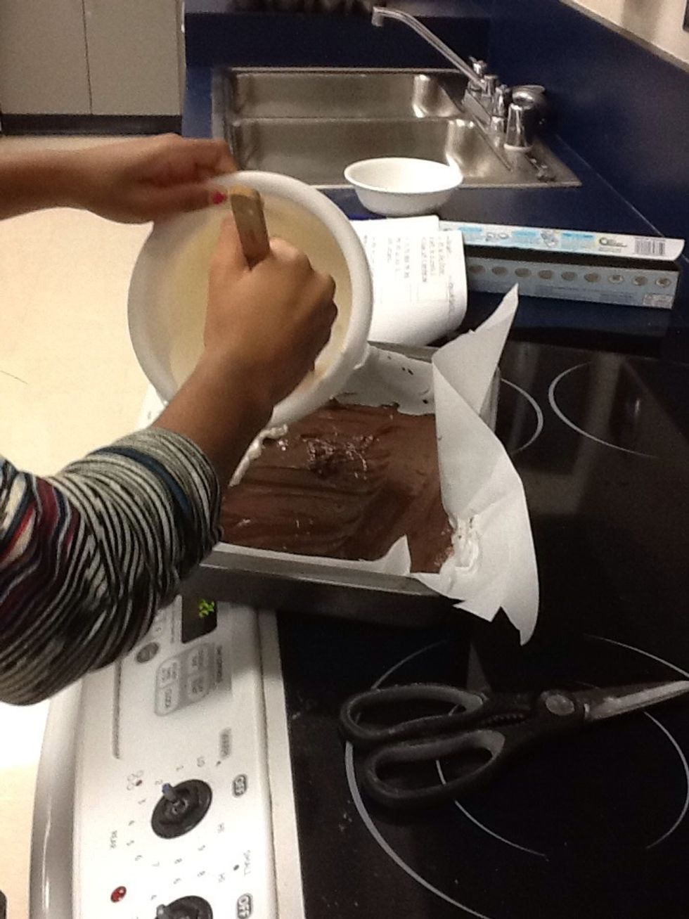 Pour the white chocolate on top of the dark chocolate.
