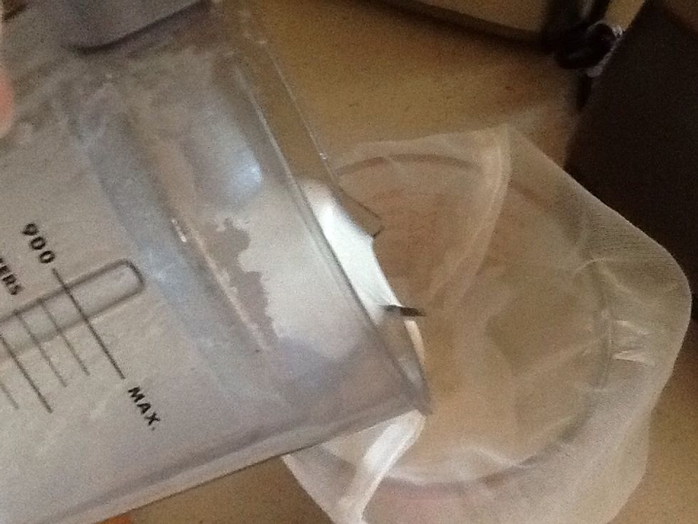 Pour through strainer into water measure cup or bowl.
