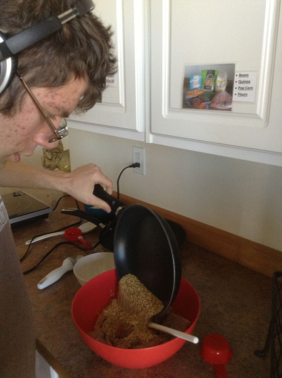 Pour toasted quinoa into bowl with ground turkey.