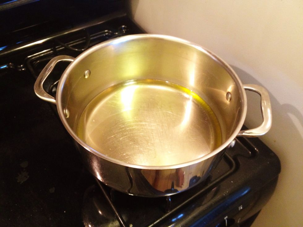 Pour vegetable oil in a pot and heat over medium.