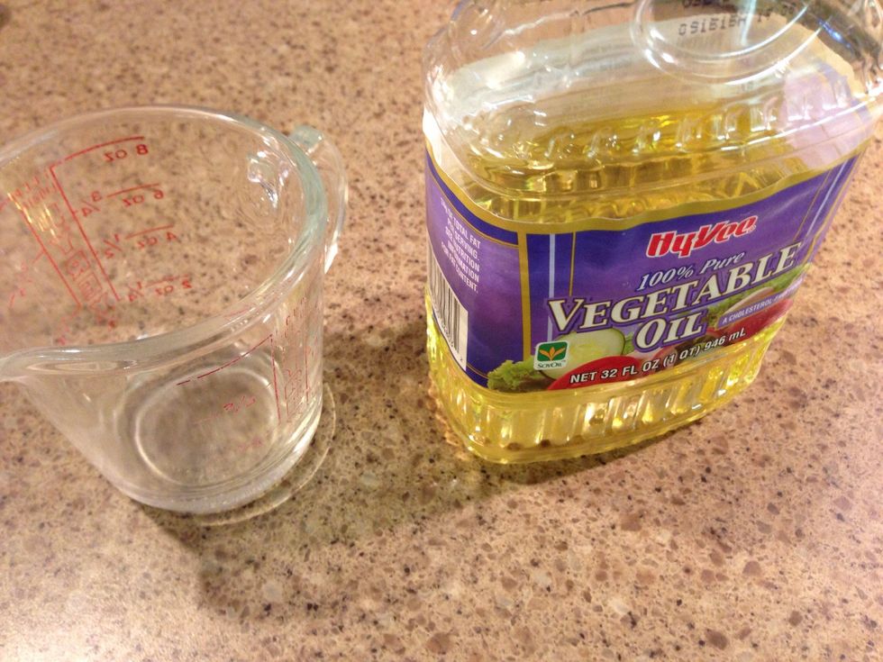 Pour vegetable oil in a small container.