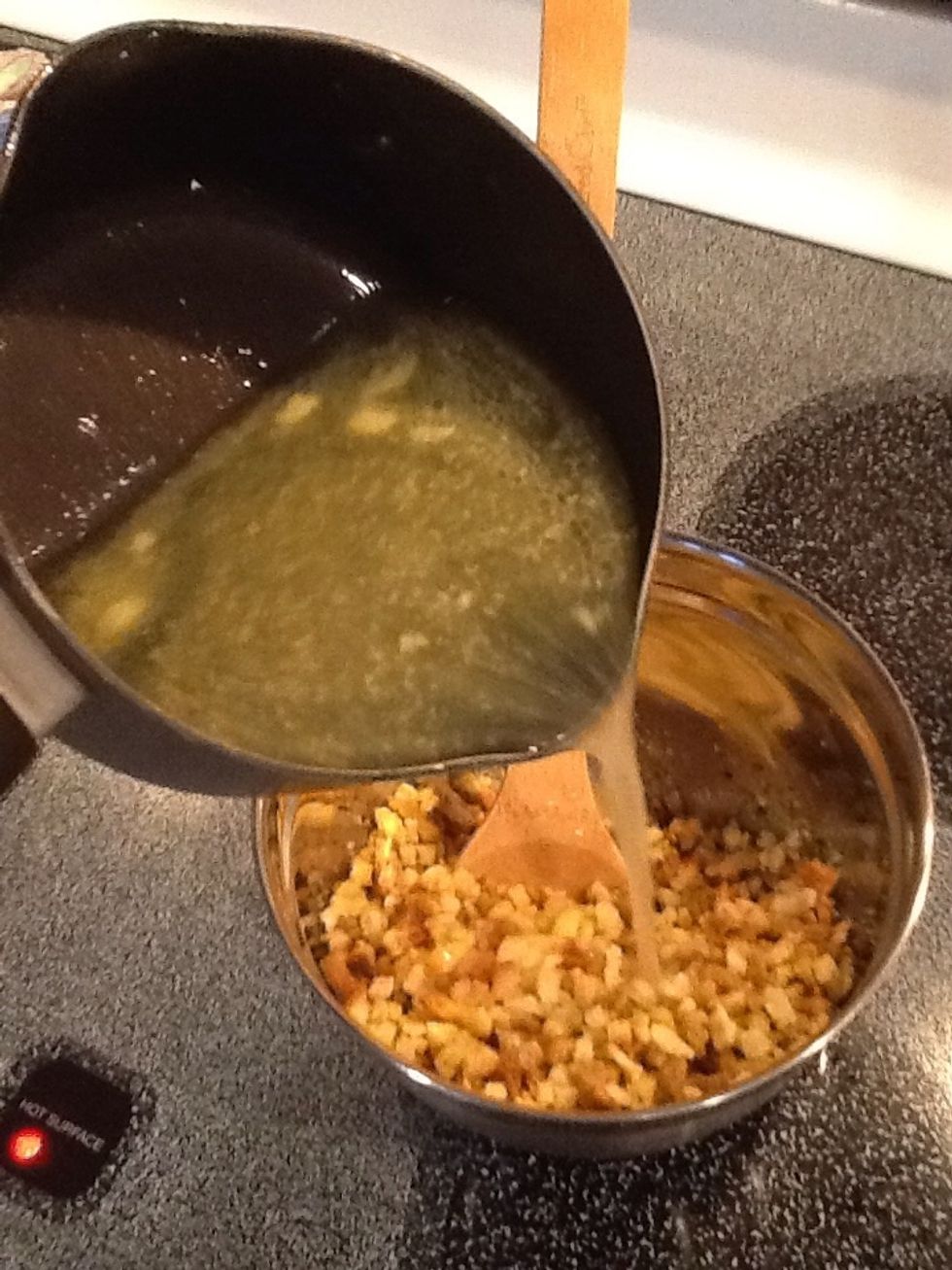 Pour water and butter mixture into the stuffing. Stir until moistened.