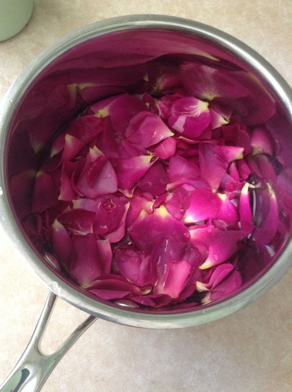 Pour water in the pan until it is just covering the petals