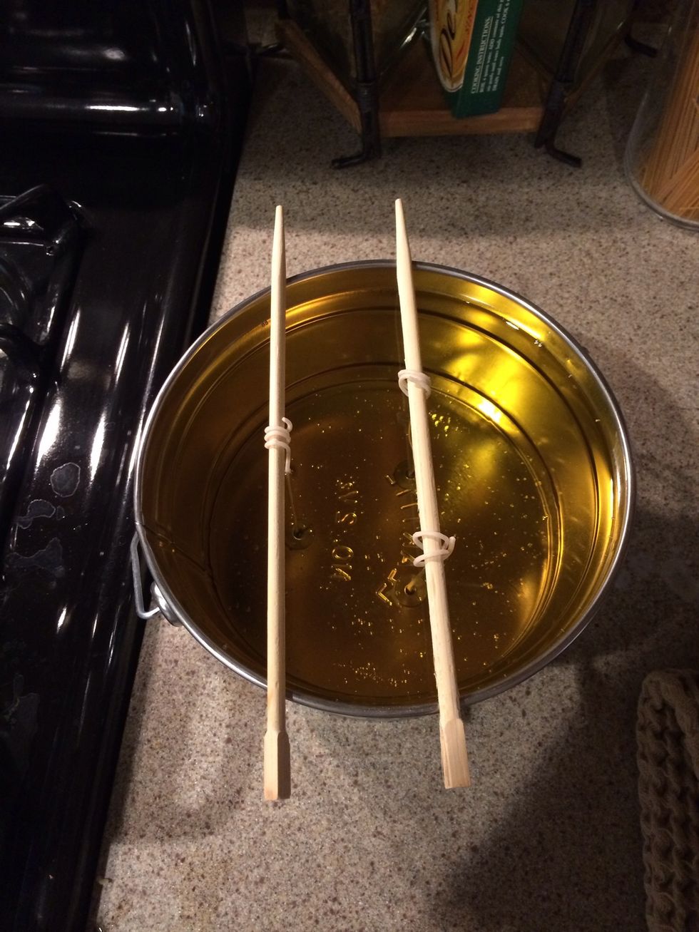 Pour wax into tin making sure to avoid wicks. Repeat steps 4-8 for the second bag of wax.