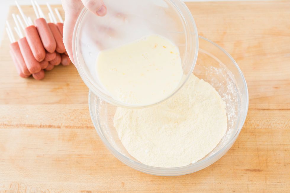 Pour wet ingredients into dry ingredients and mix until combined.